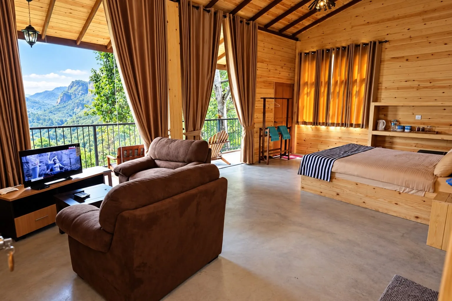 Spacious timber bedroom and seating area with open mountain-facing windows at Country Homes