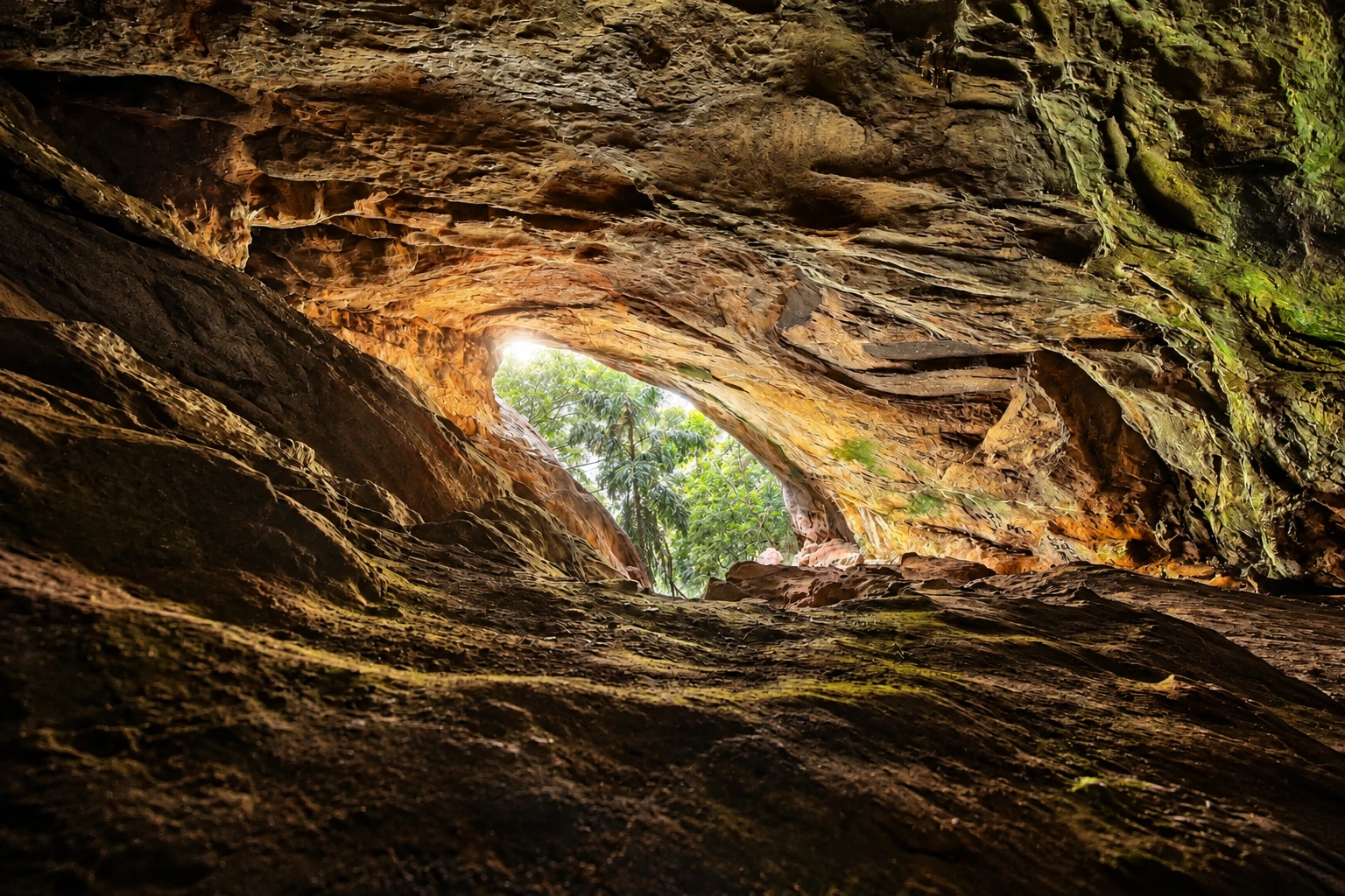 Realistic re-creation of Ravana Cave’s natural rocky interior and sunlit opening near Ella
